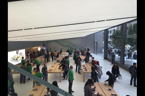 The ground floor features the familiar minimalist product displays